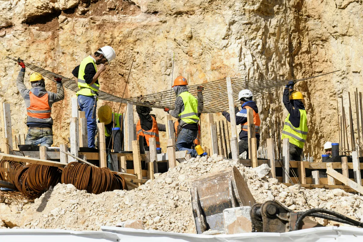 Builders at work on a new neighbourhood